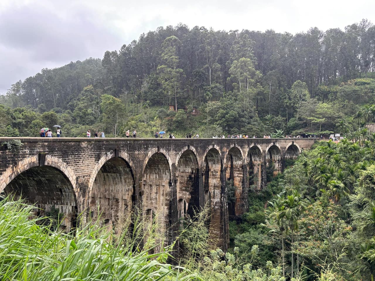 The Nine Arch Bridge curving through dense jungle near Ella in Sri Lanka's hill country